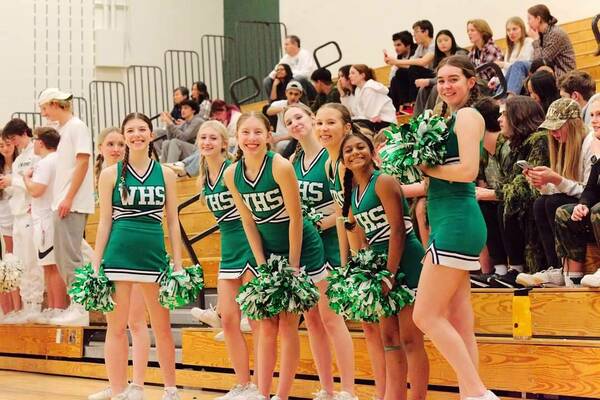 The Woodinville High School cheer squad kept the fans excited on the road against Redmond. Photo by Tushar Agarwal.