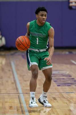 Woodinville sophomore guard Warren Bullock brings the ball down court against Skyline. Photos by Colleen Colley.