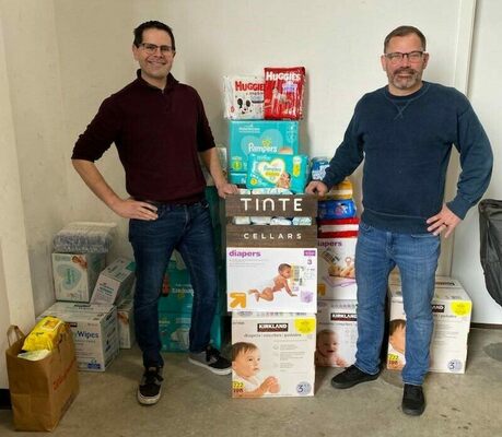The Tinte Cellars Donation Drop-Off image (pictured left to right: Tinte Cellars General Manager Cameron James and Winemaker Noah Fox Reed). Photo courtesy of Tinte Cellars.